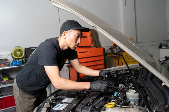 Tech working on car